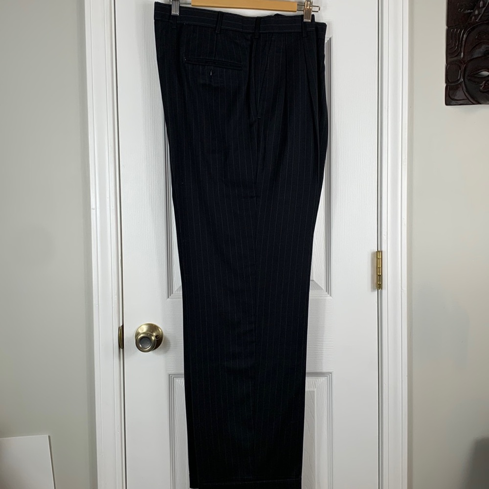 Black pleated pinstriped mens dress pants with cuff at end of leg. Waist 17.5”